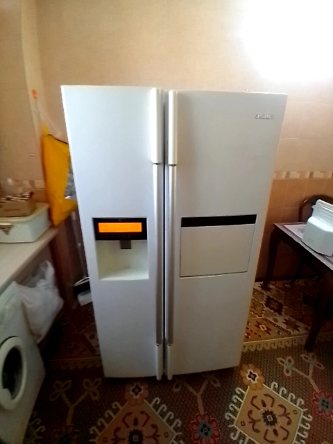 یخچال ساید بای ساید اسنوا تعمیرشده توسط متخصصان حامی سرویس در اصفهان